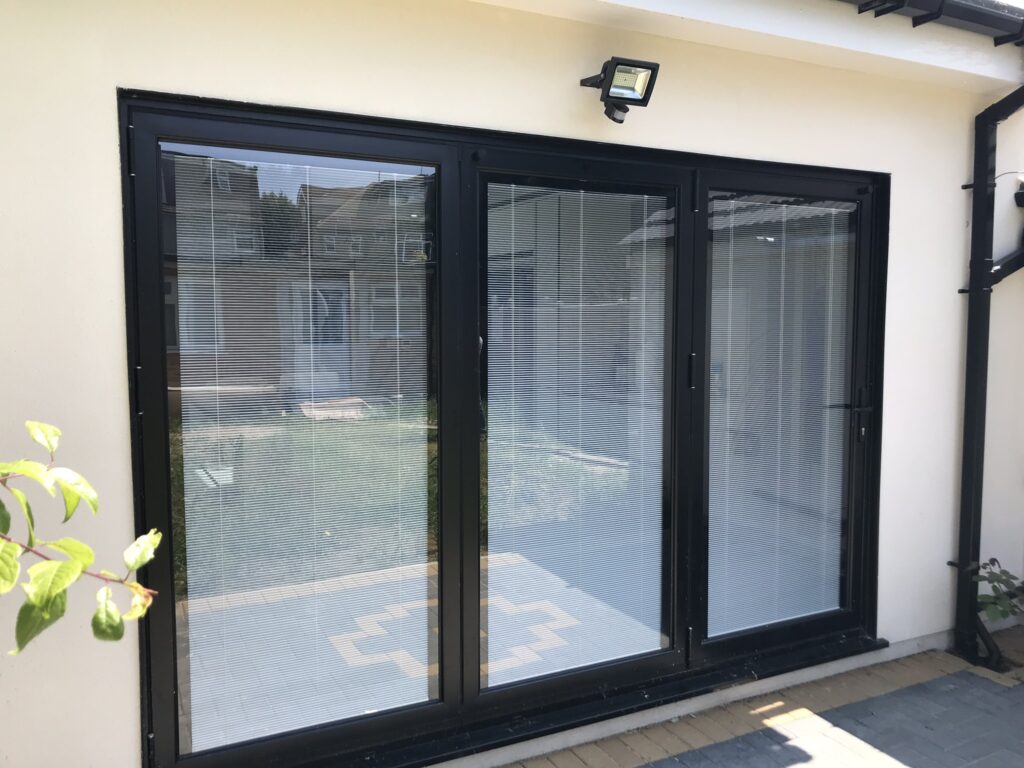 grey-bifold-doors-with-integral-blinds
